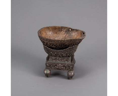 Asian Bowl, carved monkeys head, on silver or silvered stand with rich decorations and skull heads, Indo-Chinese, around 1900