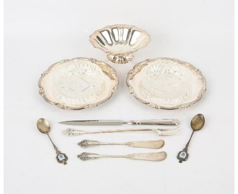 Peruvian silver marked trays with cut glass liners a pedestal dish two spoons a knife and fork.