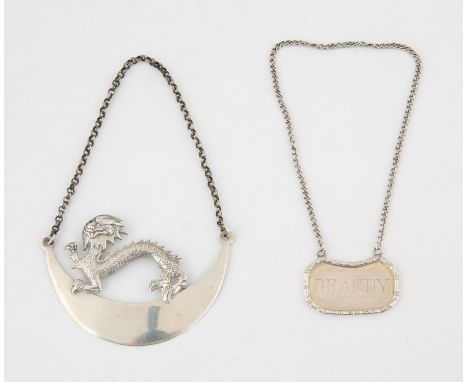 Two Chines silver white metal decanter labels. One with bamboo decoration, the other decorated with a dragon.