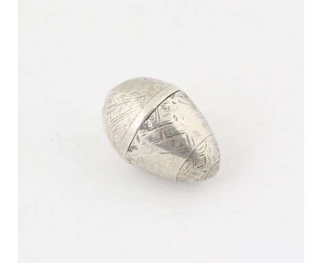 19th century French engraved silver nutmeg grinder of egg form, the top cover with Boars Head standard mark, 3.25cm