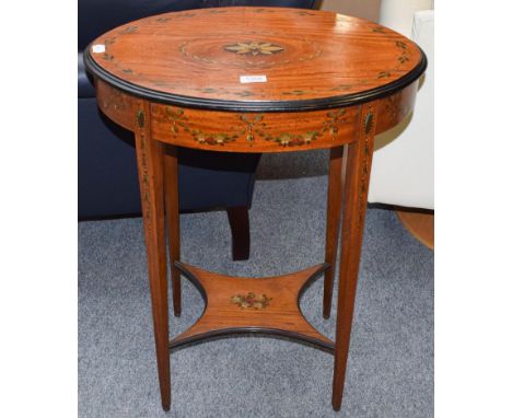 A Victorian/Edwardian Sheraton revival oval table, the satinwood oval top with ebonised edges painted with central flower, pe