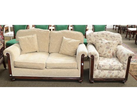 A two piece mahogany framed suite, comprising: a two seater sofa upholstered in plain foliate fabric, 150cm long, and a chair