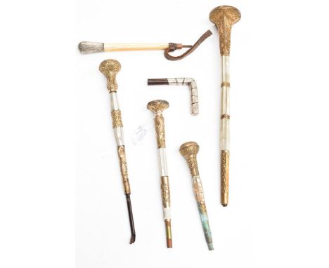 Four late 19th/early 20th century decorative mother-of-pearl and gilt metal mounted large parasol handles (some initialled), 