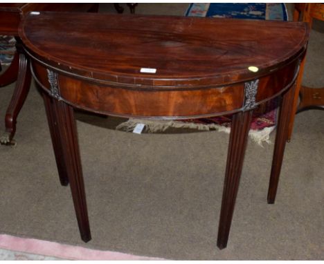 A George III string inlaid mahogany demi-lune fold over card table, 96cm by 48cm by 74cm 