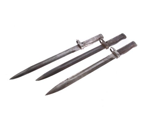 Three German Ersatz bayonets and scabbard, one having serial 7728, all marked to the spine of the blade, all with scabbards (