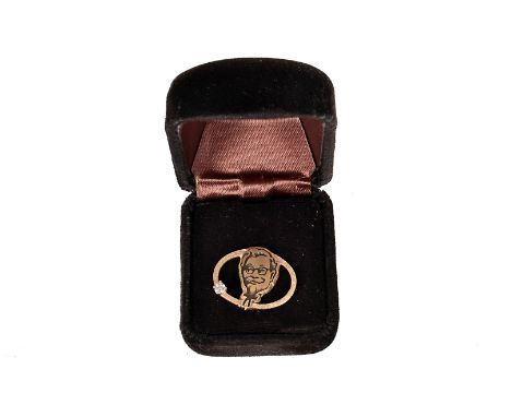 A Kentucky Fried Chicken 14k and diamond badge, having the face on Colonel Sander within and oval, having round cut diamond o