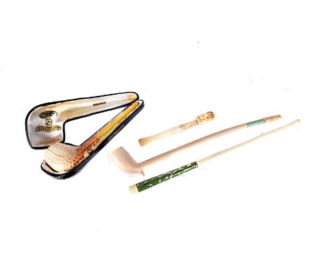 A case Meerschaum smoking pipe, having amber style stem, together with an oriental style smoking pipe, a Chinese 1920s cigare