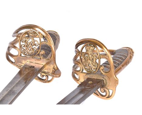 Two Victorian Officer's swords, one by Wilkinson (8038), having single fuller etched blade, wire and kriss kross hand grip, t