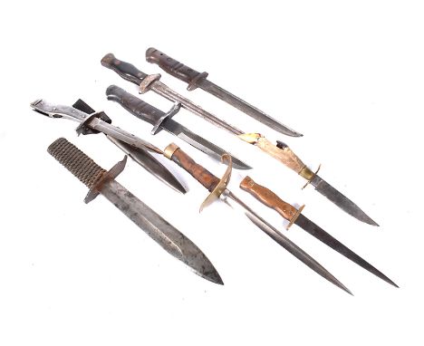 An assortment of knives, to include cut down trench bayonets, a hunting knife, a cut down German Butchers Blade knife, and mo