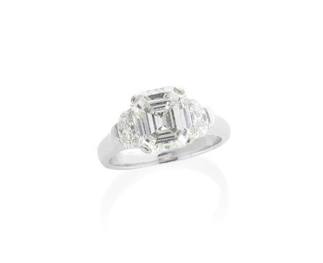 DIAMOND RINGThe step-cut diamond, weighing 3.25 carats, between demi-lune-shaped shoulders, ring size NFor further informatio