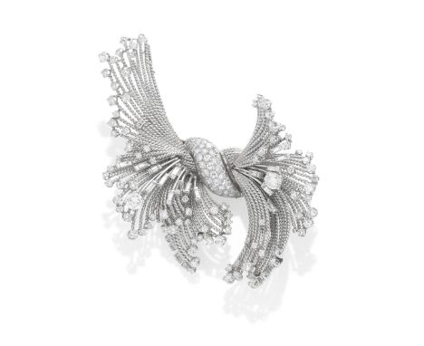 STERLÉ: DIAMOND-SET BROOCH, CIRCA 1955The curved bombé centre, pavé-set with brilliant-cut diamonds, issuing a ropetwist spra
