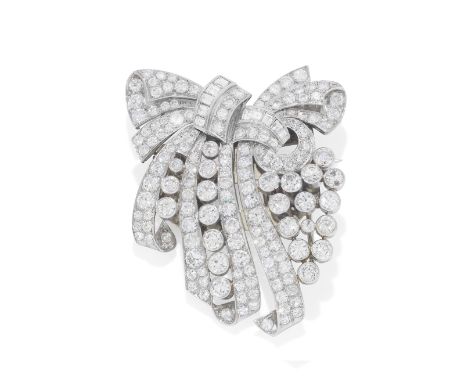 DIAMOND DOUBLE-CLIP BROOCH, CIRCA 1950The openwork scrolling ribbons set throughout with brilliant and single-cut diamonds, a