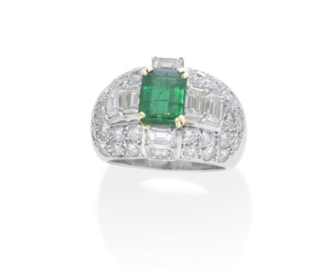 EMERALD AND DIAMOND RINGThe step-cut emerald, weighing 2.34 carats, in a brilliant-cut diamond bombé mount, with step-cut dia