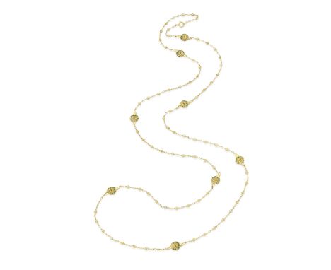 GAUTRAIT: GOLD, PLIQUE-Á-JOUR ENAMEL AND PEARL LONGCHAIN, CIRCA 1900The delicate fancy-link chain with floral motifs, set at 