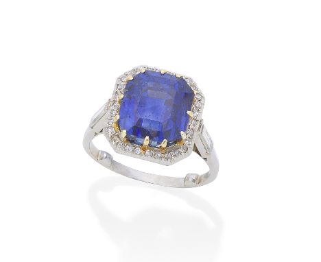 SAPPHIRE AND DIAMOND RINGThe step-cut sapphire, weighing 11.47 carats, within a single-cut diamond surround, between baguette