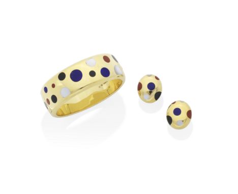ANGELA CUMMINGS FOR TIFFANY: GEM-SET BANGLE AND EARCLIP SUITE, CIRCA 1980Inlaid with circular lapis lazuli, jasper, black jad
