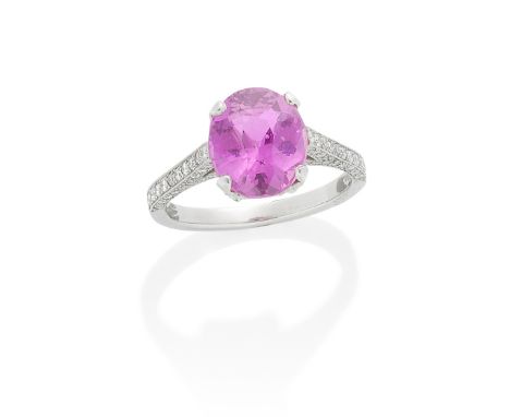 PINK SAPPHIRE AND DIAMOND RINGThe oval-cut sapphire, weighing 5.03 carats, in a raised setting, the gallery and shoulders set