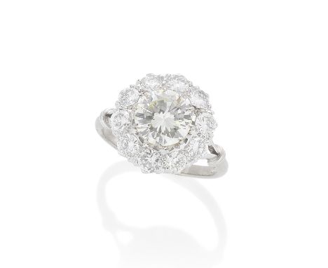 DIAMOND CLUSTER RINGThe brilliant-cut diamond, weighing 2.38 carats, within a surround of ten brilliant-cut diamonds, remaini