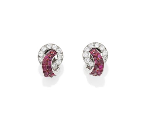 CARTIER: PAIR OF ART DECO RUBY AND DIAMOND EARCLIPS, CIRCA 1930Each brilliant-cut diamond circlet, issuing a curved graduatio