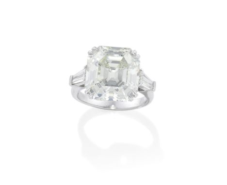 PRAGNELL: DIAMOND SINGLE-STONE RINGThe octagonal step-cut diamond, weighing 10.62 carats, between tapered baguette-cut diamon