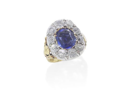 SAPPHIRE AND DIAMOND RING, 19TH CENTURYThe cushion-shaped sapphire within a surround of collet-set old brilliant-cut diamonds