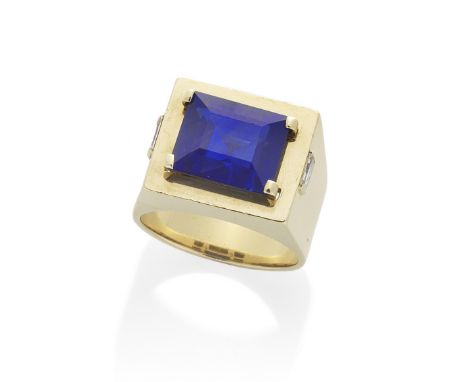 SAPPHIRE AND DIAMOND RINGThe step-cut sapphire, weighing 7.45 carats, in a rectangular mount inset with baguette-cut diamond 