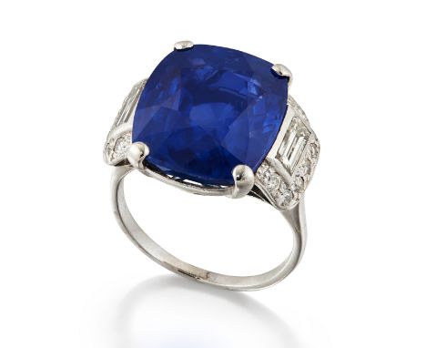 SAPPHIRE AND DIAMOND RINGThe cushion-shaped sapphire, weighing 13.14 carats, between pavé-set old brilliant-cut diamond shoul