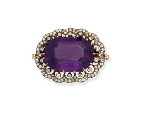 AMETHYST AND DIAMOND BROOCH/CLASP, LATE 19TH CENTURYThe large octagonal step-cut amethyst within a scalloped surround of old 