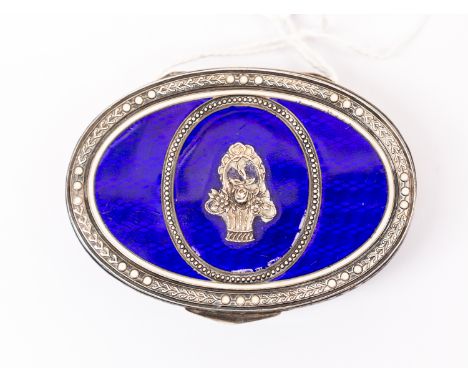 A continental white metal and enamel snuff box, stamped 900, blue enamel and floral decoration, oval in form, size approx 63 