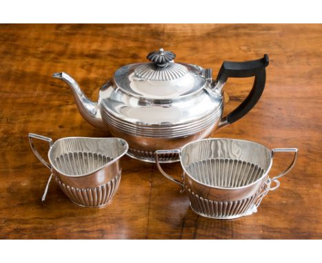 A late Victorian matched silver three piece tea service, the teapot hallmarked for Sheffield 1896, stamped 'MS', milk jug and