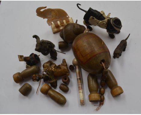 A cold painted spelter dachshund, cat bronzed flowers with initials, mother of pearl elephant, elephant puppet etc inc soapst