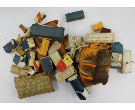 Military interest; Shell dressing, 1940, first aid kit 1951, life jacket dinghy and a large quantity of field dressings and b