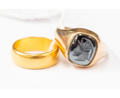 A 22 ct gold wedding band approx 8 gms, size M,  and a 9 ct ring set with intaglio hematite, size T1/2, approx 9 gms (2)