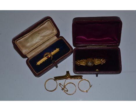A Victorian/Edwardian 9ct brooch set with pearls in a box, along with another Victorian crescent brooch 9ct gold set with rub