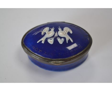 A Bilston cobalt blue enamel snuff box with raised pattern of two love birds in white.