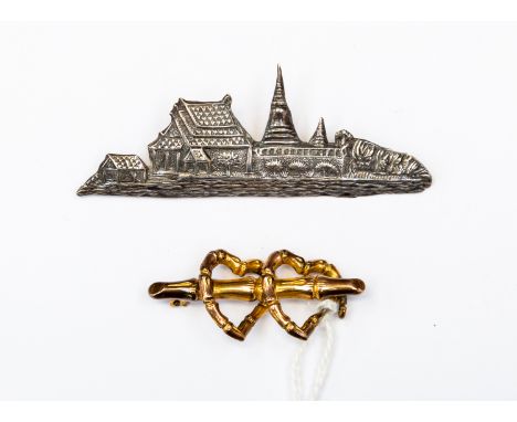 A 9ct gold sweetheart brooch A/F, together with a Siamese silver brooch, Thailand