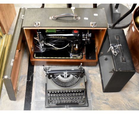 Cased sewing machine with a cased vintage typewriter