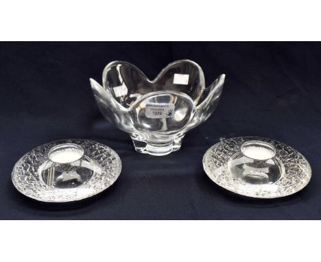 An orrefors glass bowl, of flared petal form, 12 cms high approx together with two orrefors candle holdersCondition: No obvio