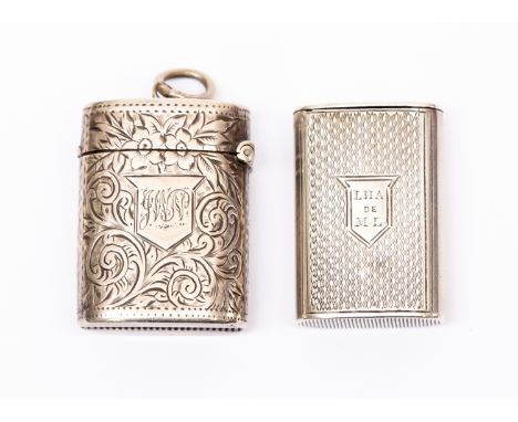 A Victorian silver vesta case, oblong shaped with engine turned decoration with shaped cartouche engraved with initials LHA d