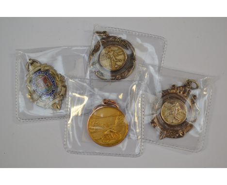 Medals: A collection of four assorted sporting medals to include: a 9ct gold medal for 'The Bristol Motor Cycle Club' depicti