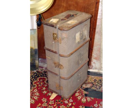 A canvas covered travel trunk.