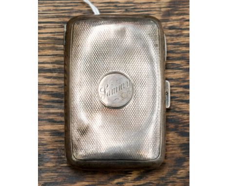 A late Victorian silver cigarette case, Birmingham 1899, decorated with engine turned decoration and a Chester silver bow bro