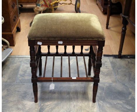 A Victorian Aesthetic mahogany piano stool woth turned gallery stretcher and green velour upholstered seat