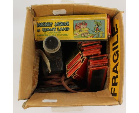 A projector with glass slides, including Mickey Mouse