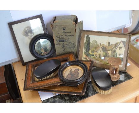 Two Ebony brushes, ebonised frames, marble egg timer, two frames, a framed watercolour and signed photograph together with a 