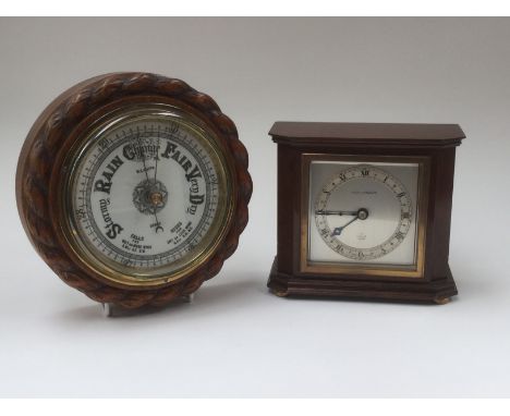 A Mappin &amp; Webb Elliott mantle clock, late 1930's together with a circular barometer W.E Watts, Derby, oak cased, aneroid