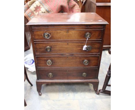 A Georgian commode in the form of a chest.