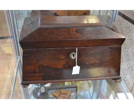An early Victorian rosewood sarcophagus tea caddy, fitted interior with original bowl 