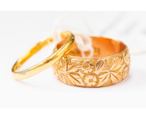 A 22 ct gold ring, weight approx 2.4 gms and a 9 ct gold ring, weight approx 6 gms  (2) 