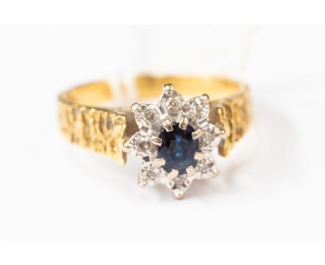 A sapphire and diamond set dress ring, circa  1970's textured shank, size N, total gross weight approx 4.7 gms